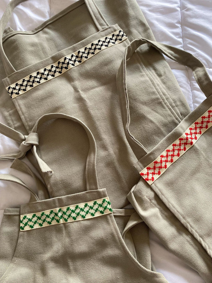 Bundle of Three Aprons, Family